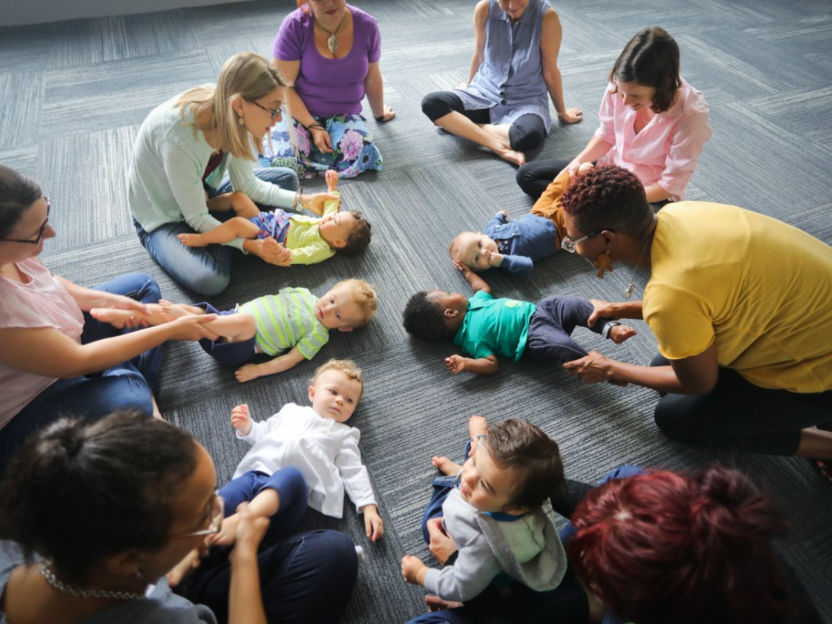 Caregivers and babies enjoying songs and sensory play